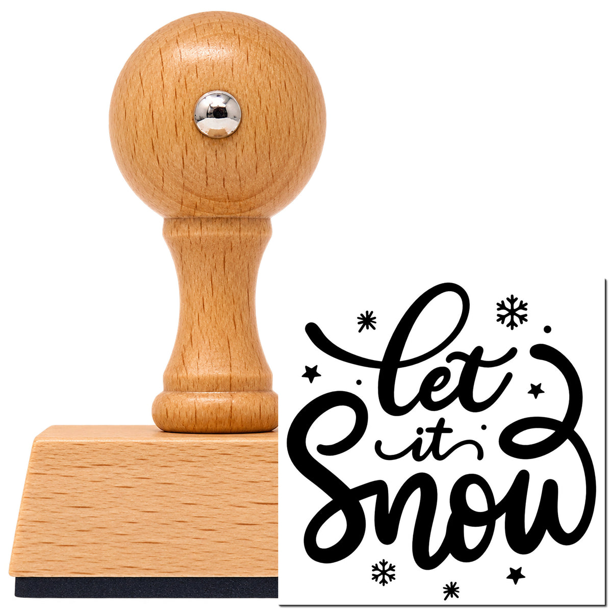 Let It Snow Script Vintage Pro rubber stamp in European beech wood with a round knob handle, shown beside its black imprint.