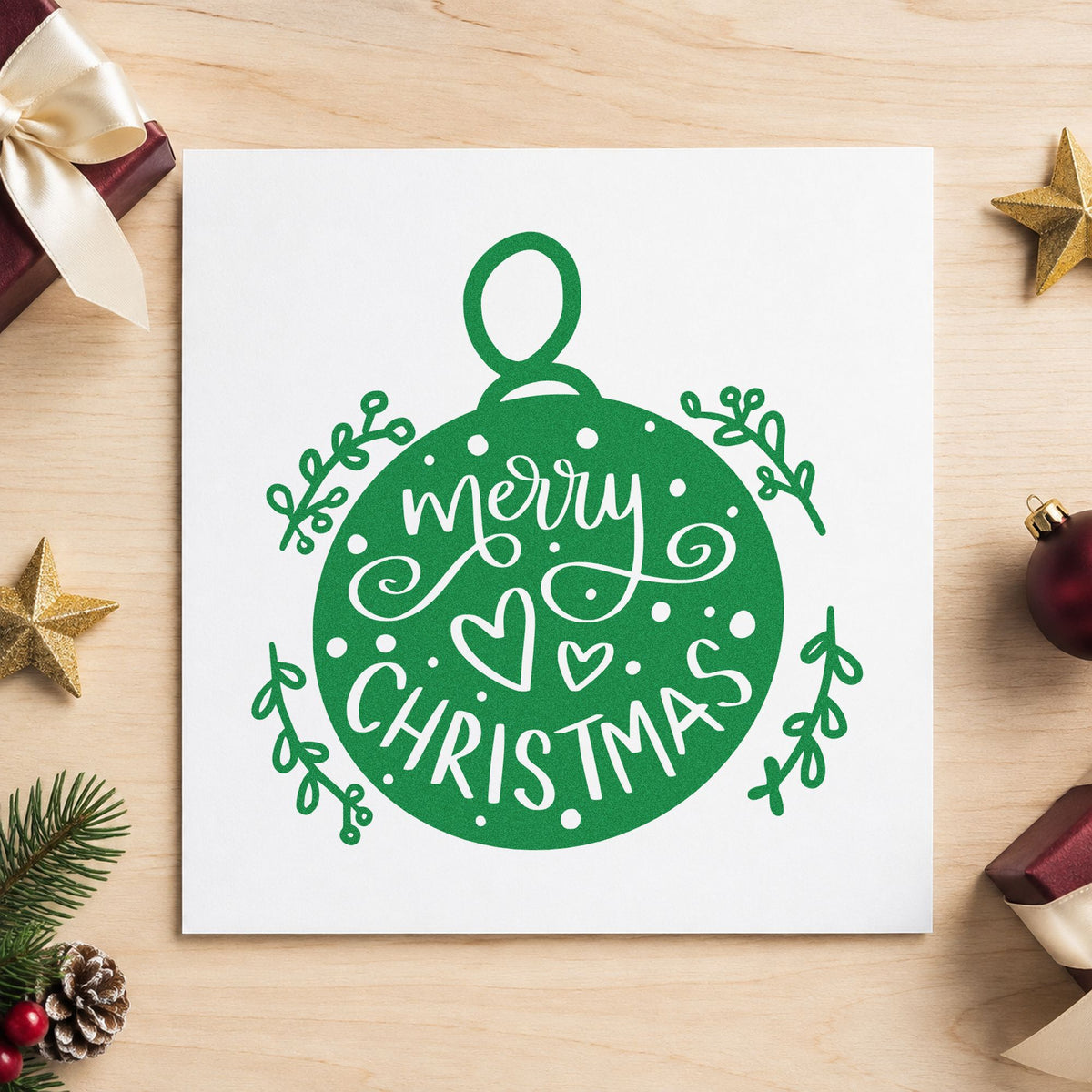 Merry Christmas Round Ornament craft stamp imprint in green ink on a handmade project, one idea being framed tree corner.