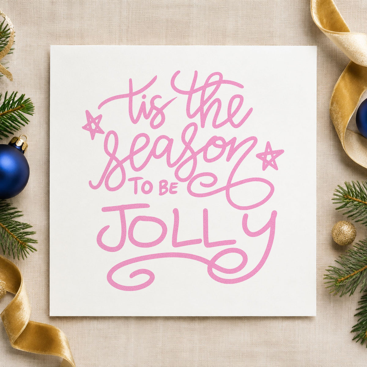Tis The Season To Be Jolly craft stamp in purple ink on cardstock, an easy option for coloring shape tags.