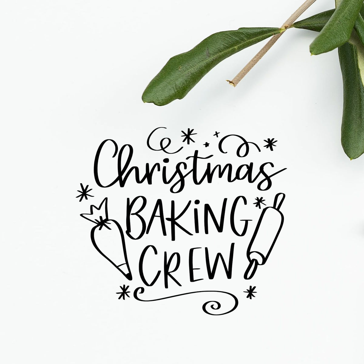 Christmas Baking Crew Rolling Pin Stamp - Premium Vintage Pro Wooden imprint stamped in black ink. "Christmas Baking Crew" is surrounded by a piping bag, rolling pin, stars, and curls.