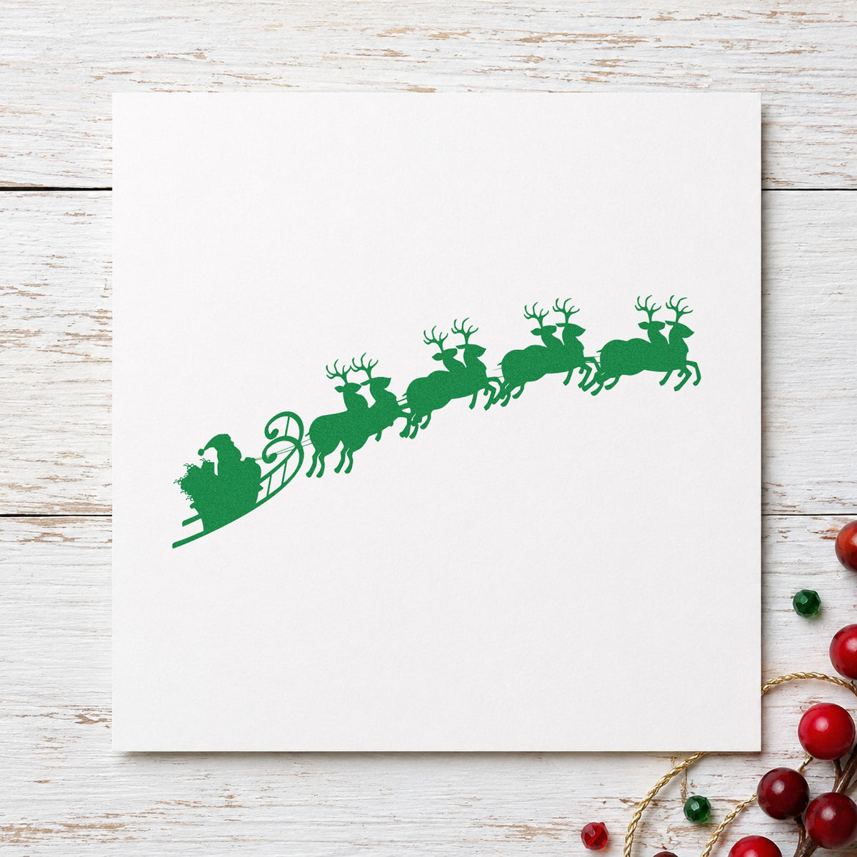 Santa Sleigh And Reindeer craft stamp imprint in green ink on a handmade project, one idea being framed ceiling flight.
