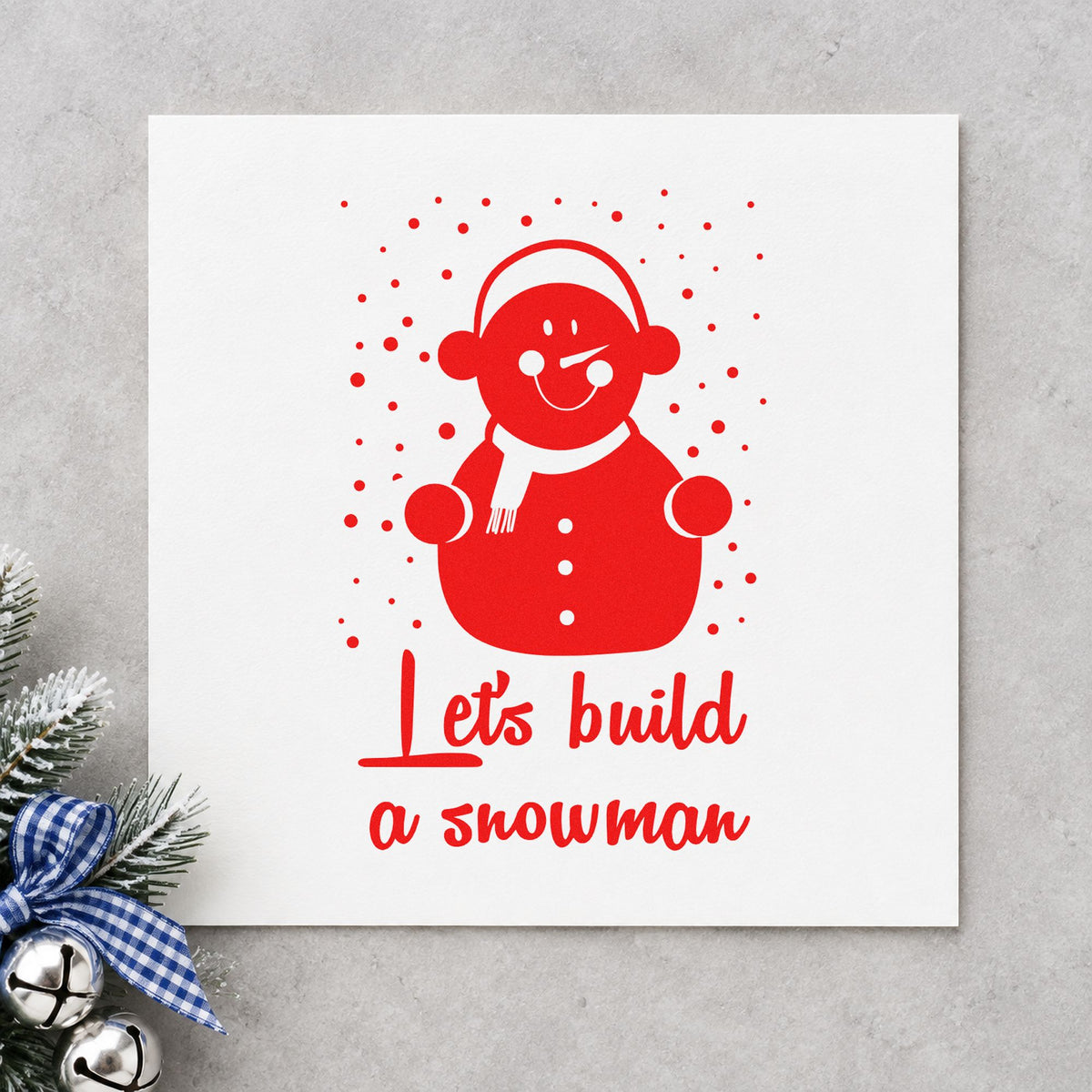 Let's Build A Snowman rubber stamp shown in red ink, stamped for projects such as first snow notes.