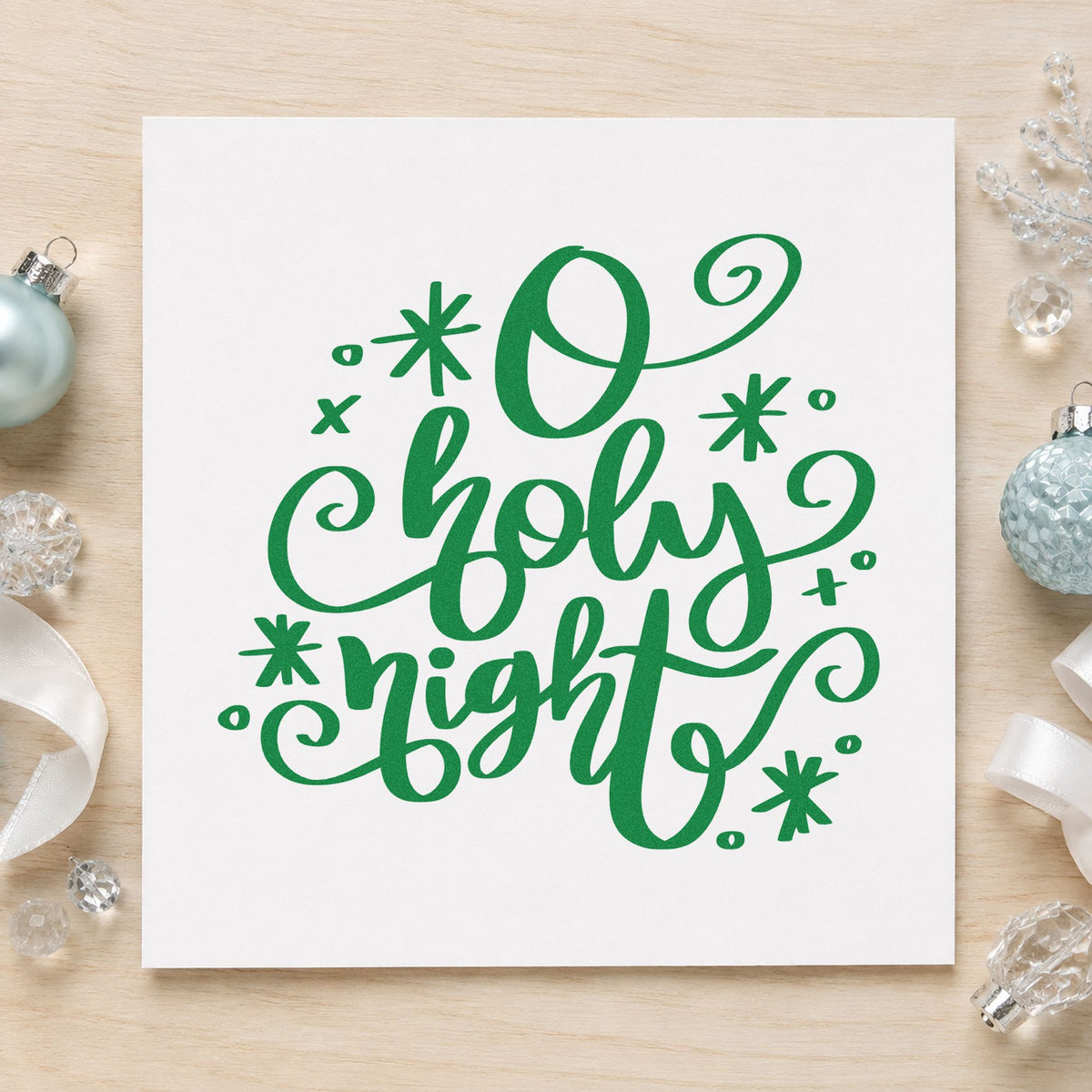 O Holy Night Flourishes craft stamp imprinted in green ink on paper, a design suited to programme seals.