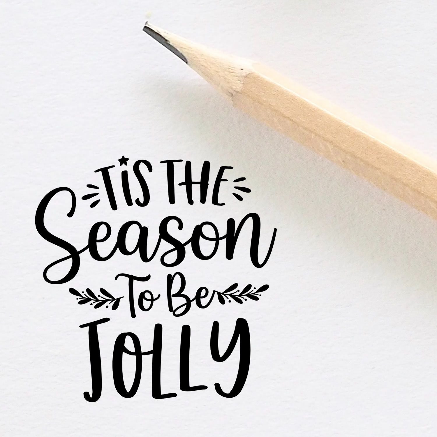 Christmas rubber stamp design reading Tis the Season to Be Jolly in decorative script.