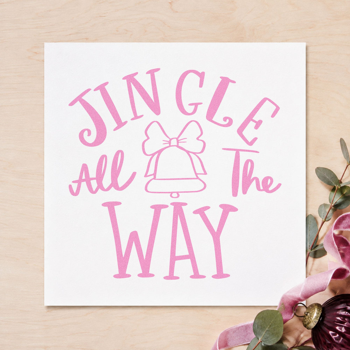Jingle All The Way Bell craft stamp in purple ink on cardstock, an easy option for caroling songbooks.
