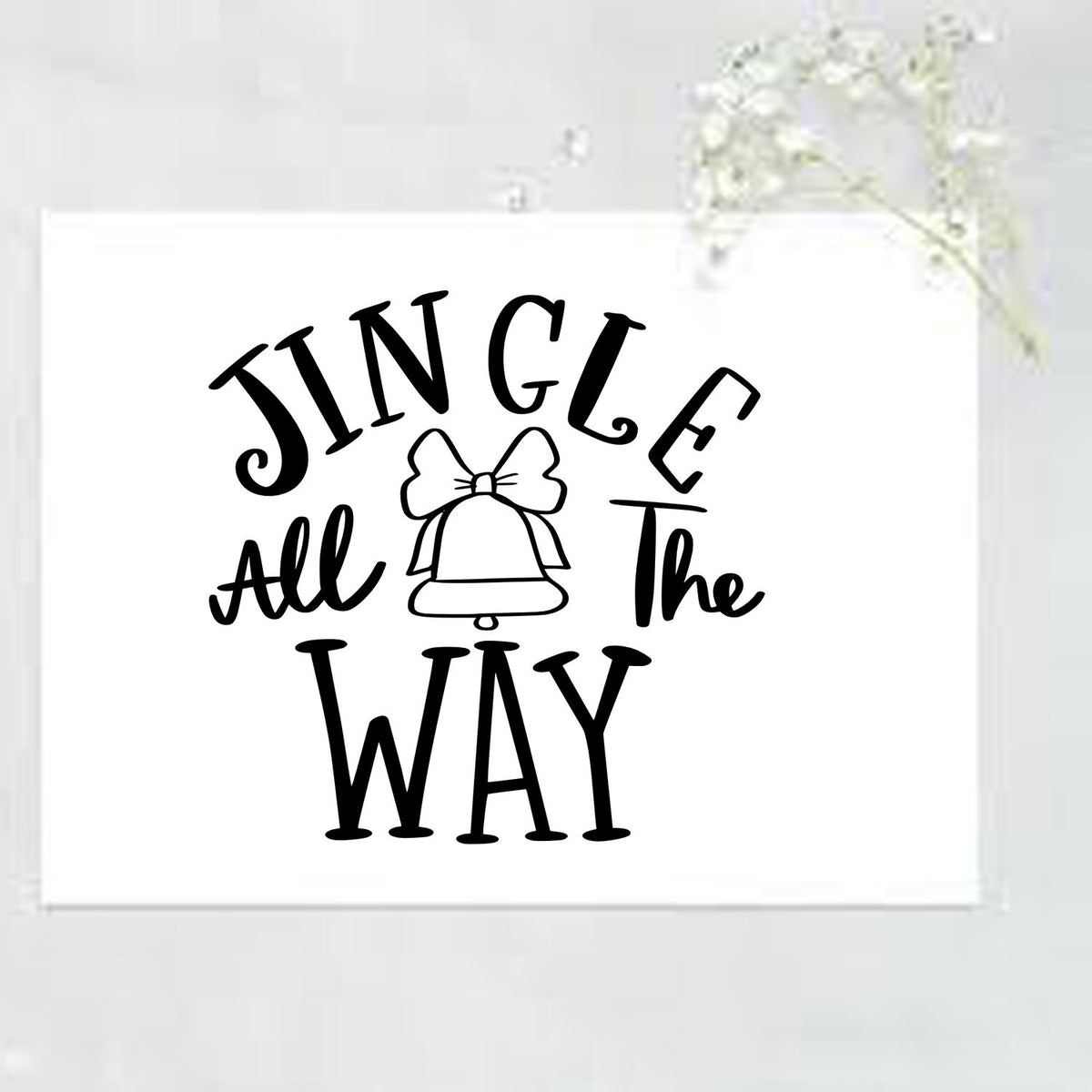 Jingle All The Way Bell Premium Wooden Stamp - Vintage Pro imprint stamped in black ink. "Jingle All the Way" surrounds a bell topped with a bow.