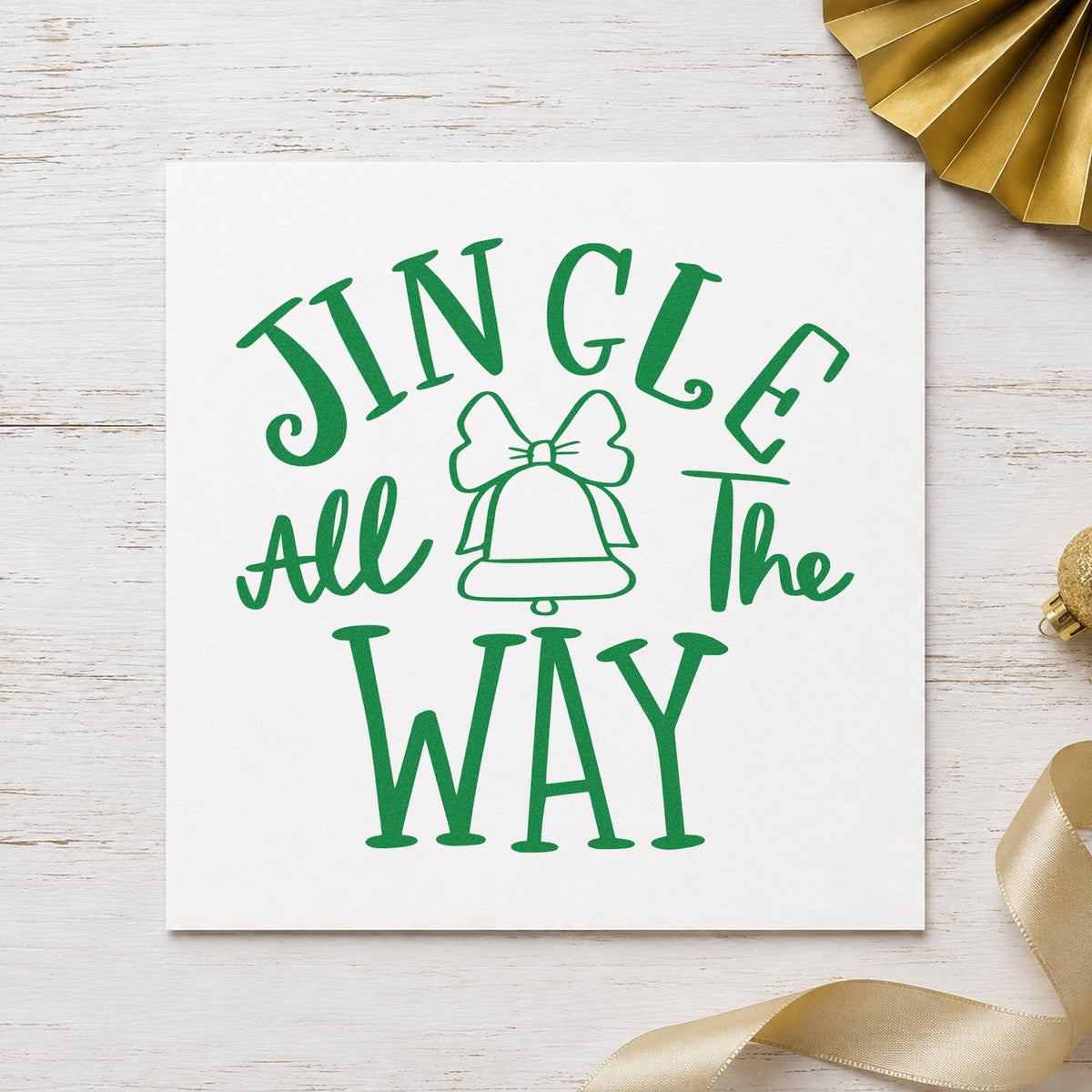 Jingle All The Way Bell craft stamp imprint in green ink on a handmade project, one idea being sleigh ride tags.