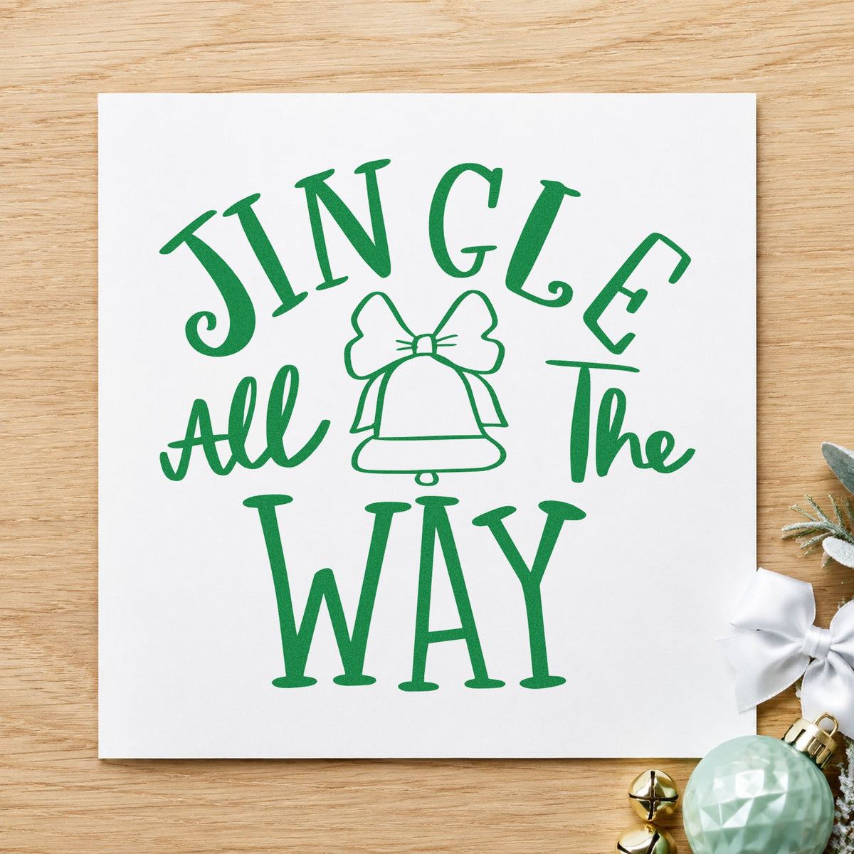Jingle All The Way Bell craft stamp imprinted in green ink on paper, a design suited to framed piano wall.