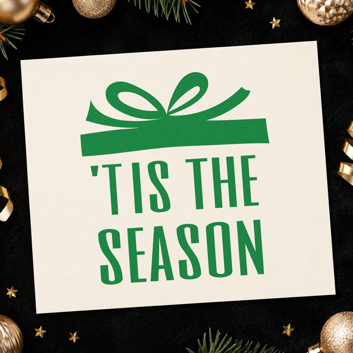 Tis The Season Gift craft stamp imprint in green ink on a handmade project, one idea being gala table numbers.