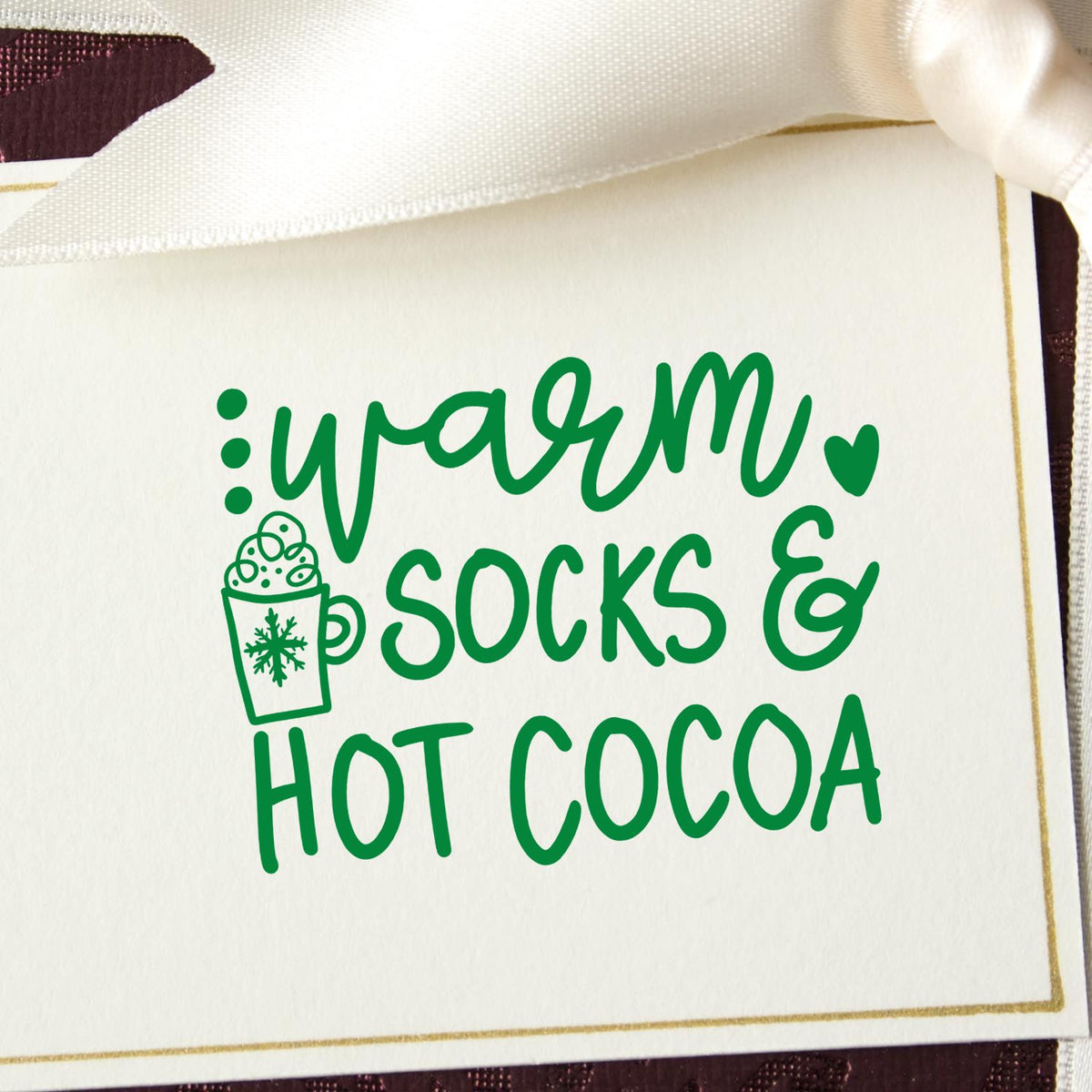 Warm Socks And Hot Cocoa rubber stamp shown in green ink, stamped for projects such as winter nights album.
