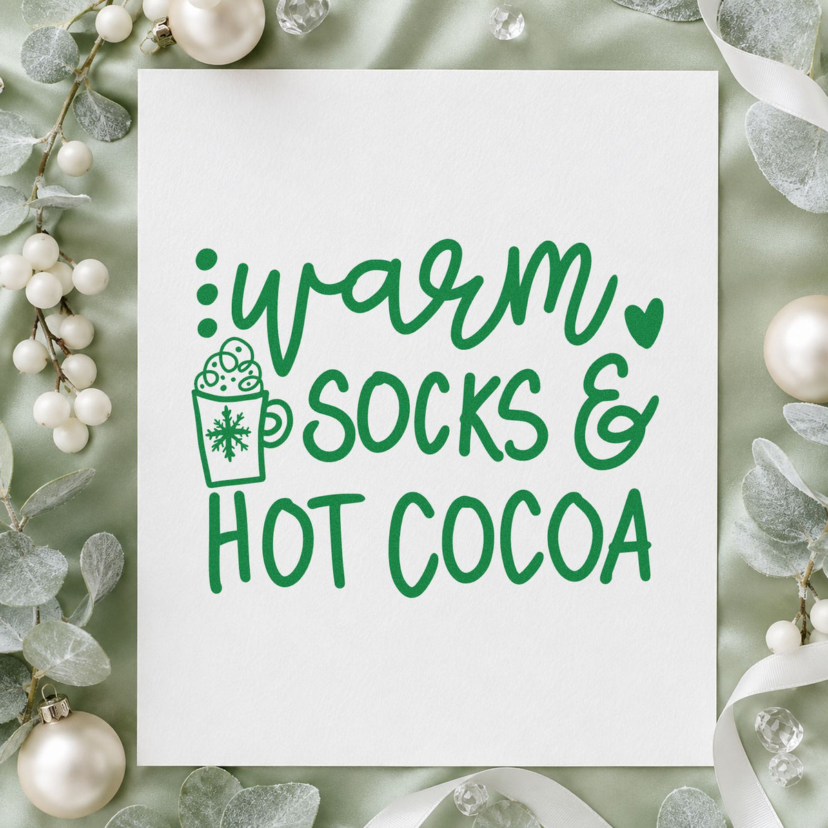 Warm Socks And Hot Cocoa craft stamp imprint in green ink on a handmade project, one idea being sock bundle tags.