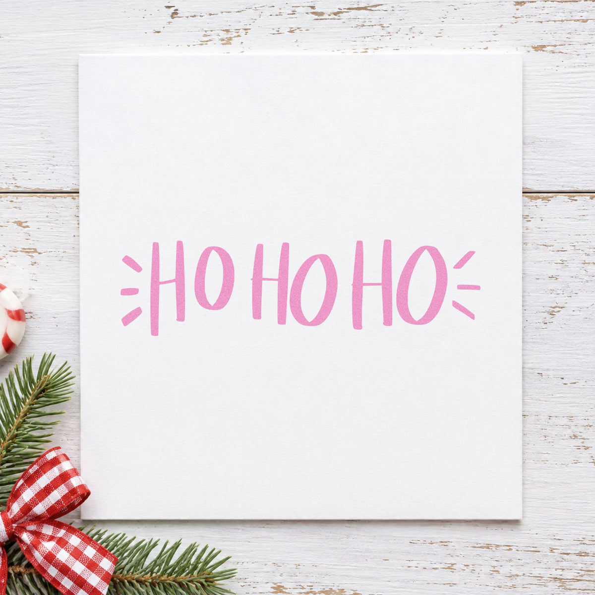 Ho Ho Ho Lettering craft stamp in purple ink on cardstock, an easy option for repeat pattern paper.