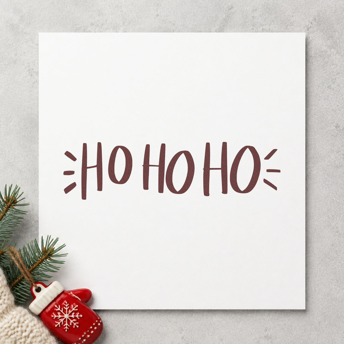 Ho Ho Ho Lettering rubber stamp printed in brown ink, ready for advent countdown grid and similar paper crafts.