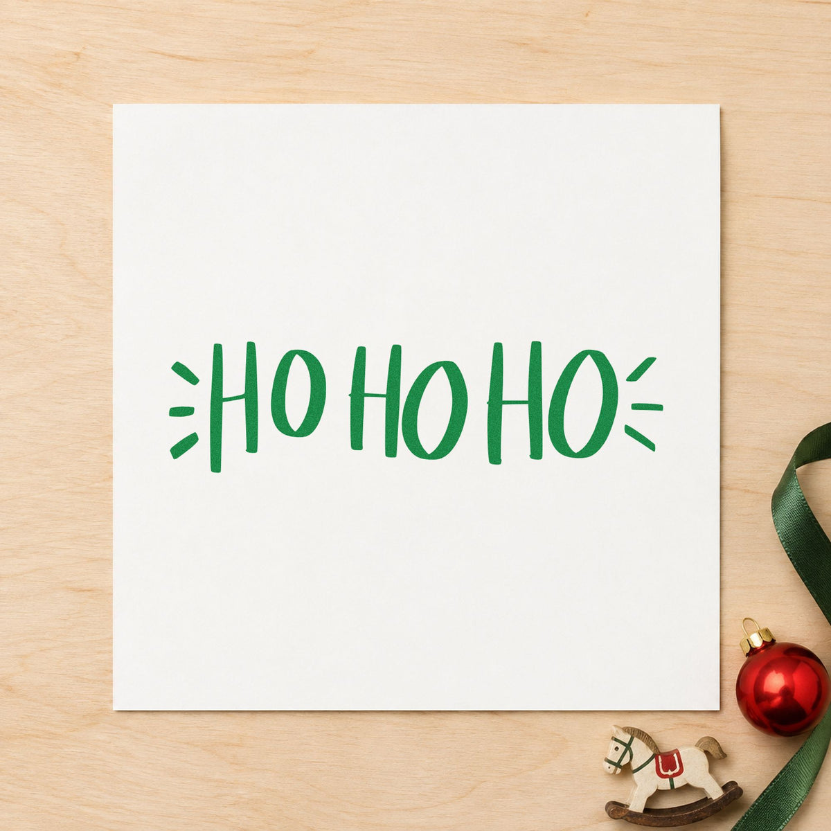 Ho Ho Ho Lettering craft stamp imprinted in green ink on paper, a design suited to framed playroom art.