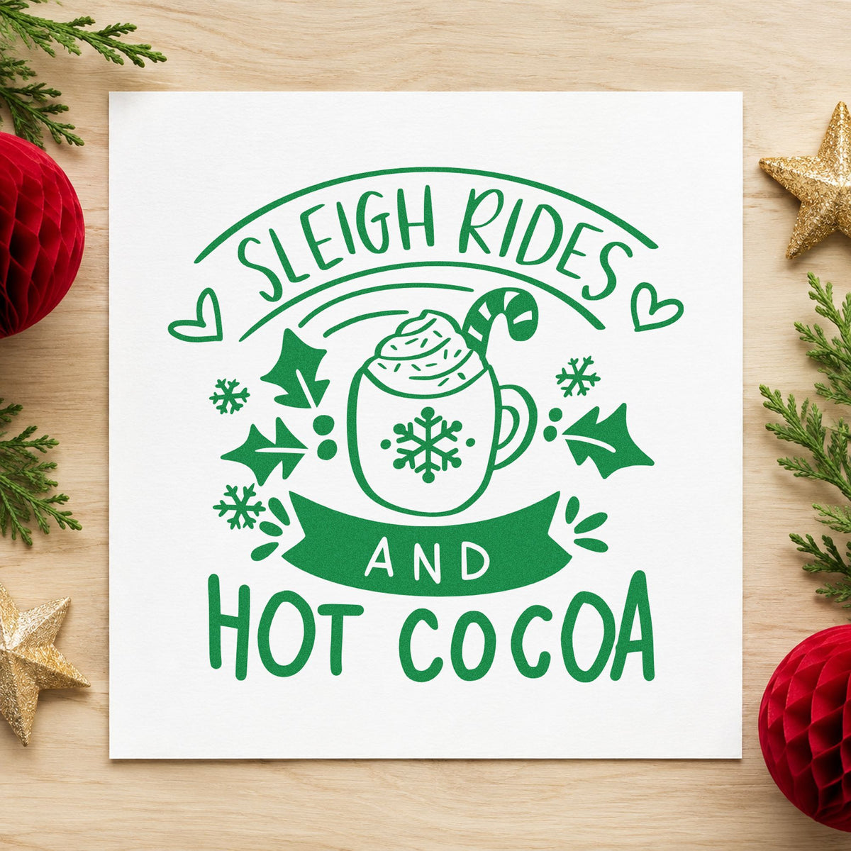 Sleigh Rides And Hot Cocoa craft stamp imprint in green ink on a handmade project, one idea being horse barn gift tags.