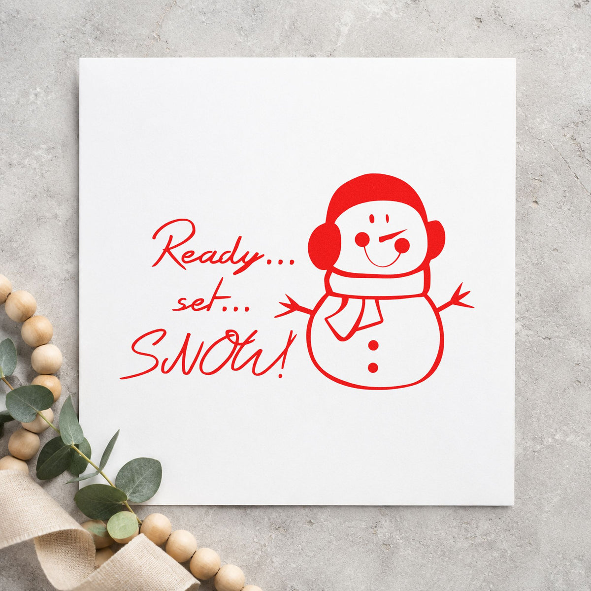 Ready Set Snow Snowman craft stamp in red ink on cardstock, an easy option for snowsuit bag ink.