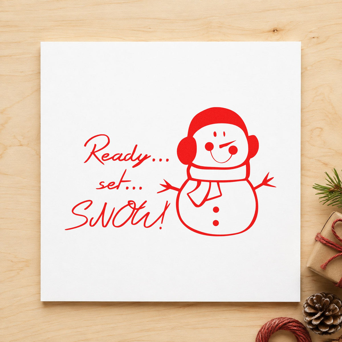 Ready Set Snow Snowman rubber stamp shown in red ink, stamped for projects such as craft bin labels.
