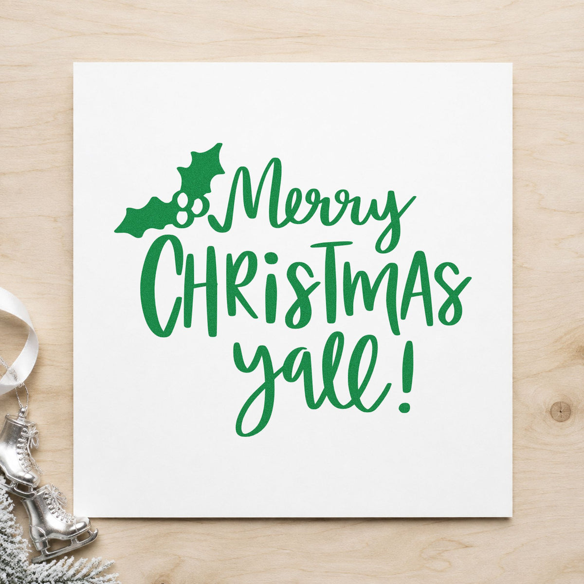 Merry Christmas Yall Holly craft stamp imprint in green ink on a handmade project, one idea being pecan bag gift tags.