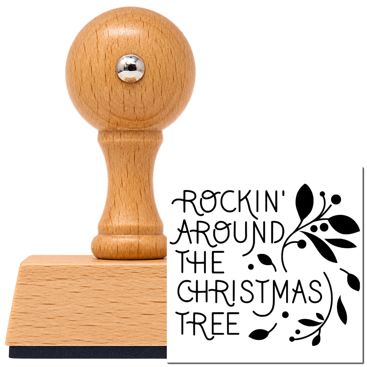 Rockin' Around The Christmas Tree Vintage Pro rubber stamp in European beech wood with a round knob handle, shown beside its black imprint.