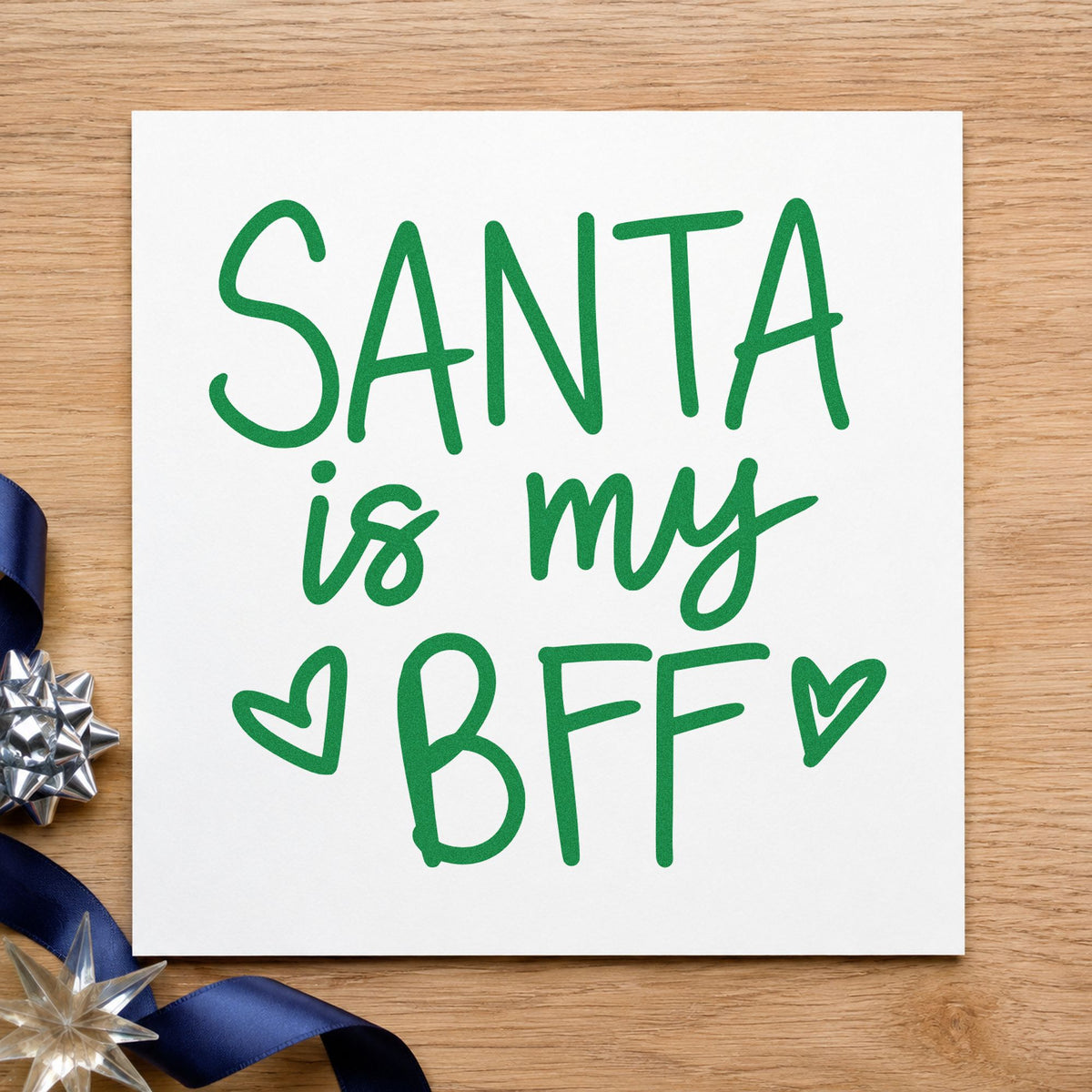 Santa Is My BFF craft stamp imprint in green ink on a handmade project, one idea being movie night passes.