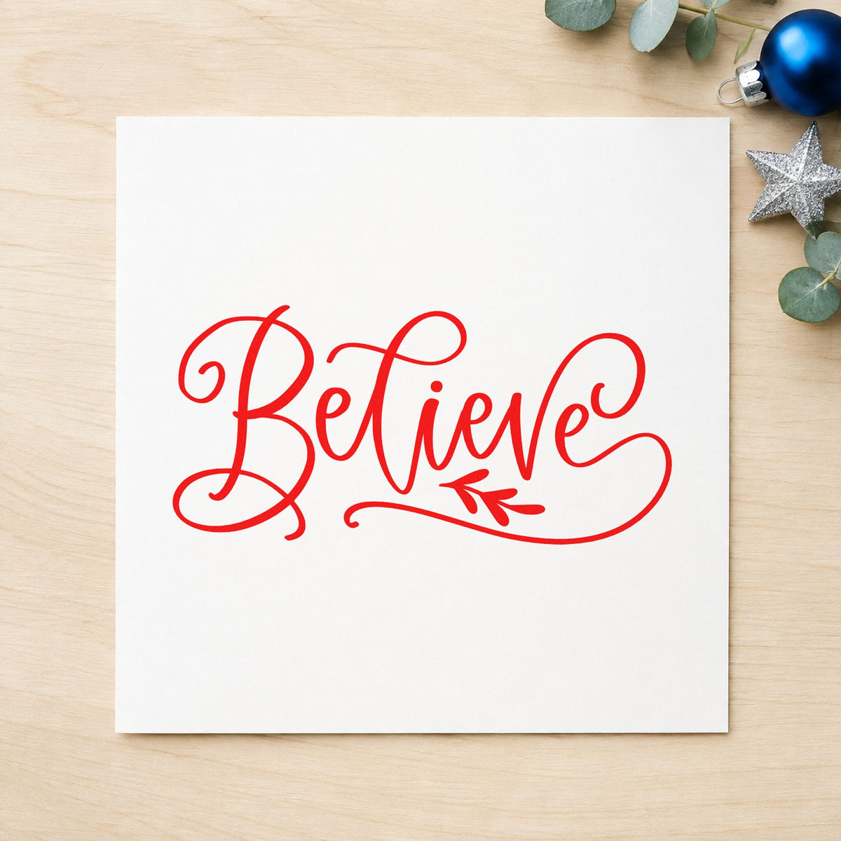 Believe With Leaf Flourish craft stamp in red ink on cardstock, an easy option for sash ribbon printing.