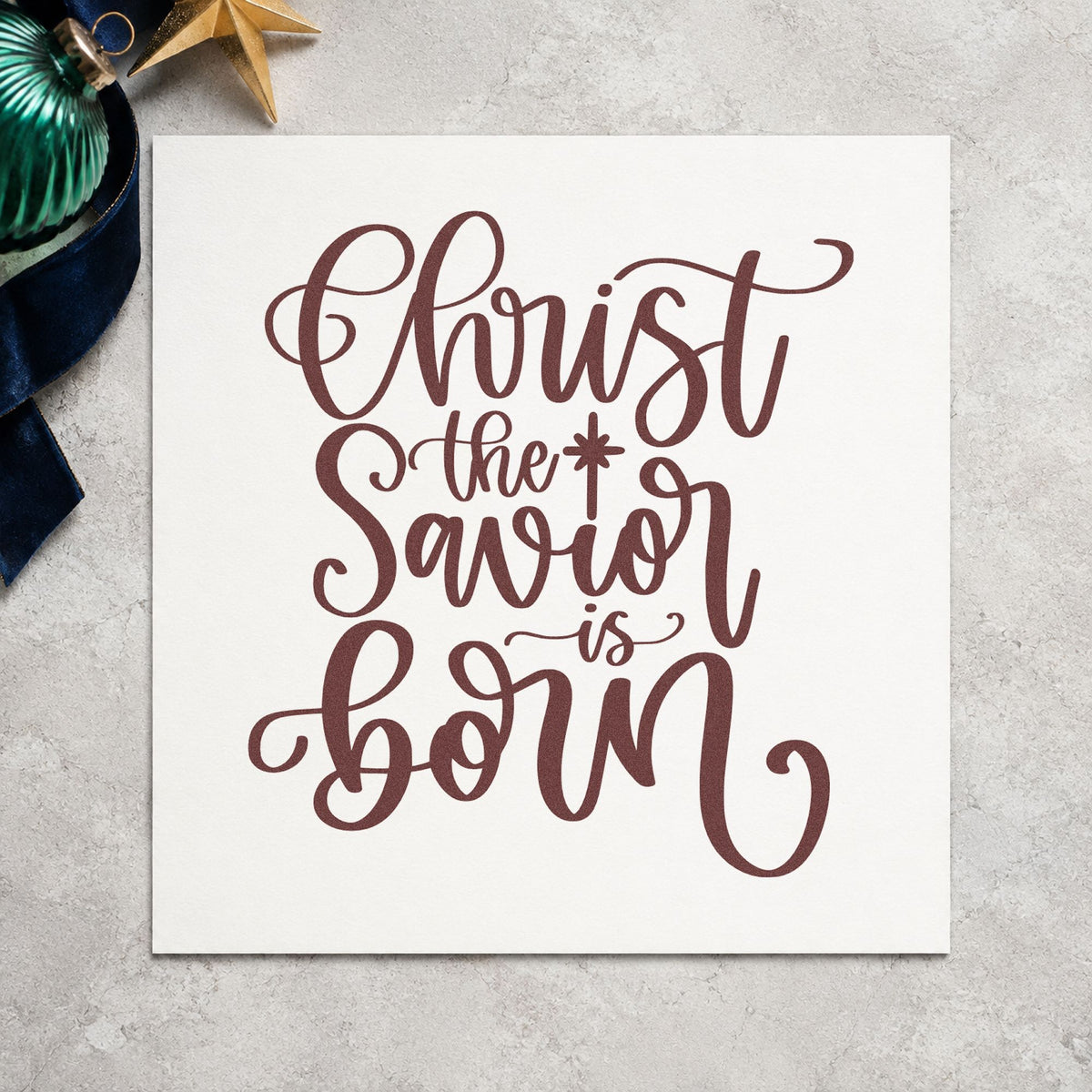Christ The Savior Is Born rubber stamp printed in brown ink, ready for choir practice sheet and similar paper crafts.