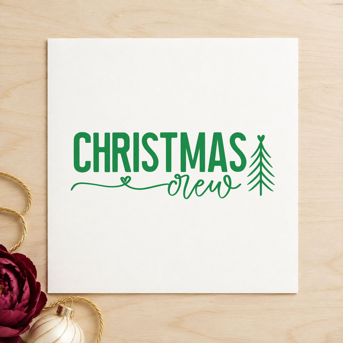 Christmas Crew With Tree craft stamp imprint in green ink on a handmade project, one idea being crew member tags.