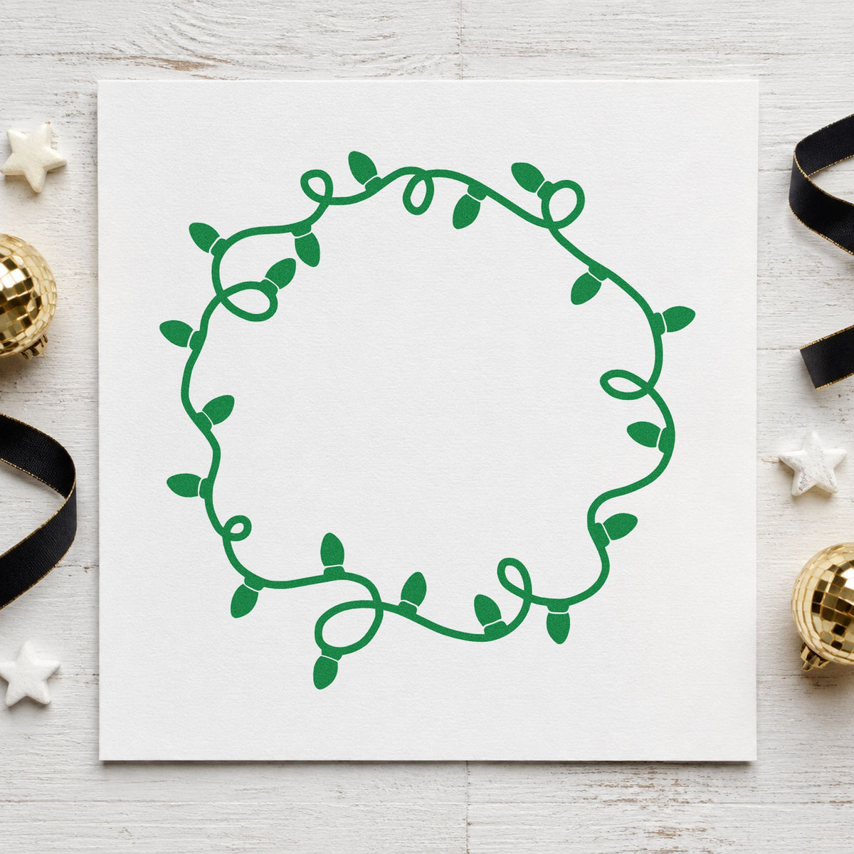 Circular Christmas Light Border craft stamp imprinted in green ink on paper, a design suited to framed monogram art.