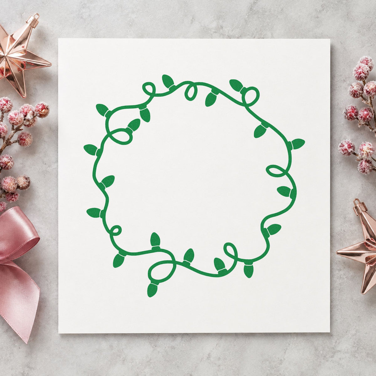 Circular Christmas Light Border craft stamp imprint in green ink on a handmade project, one idea being table number discs.