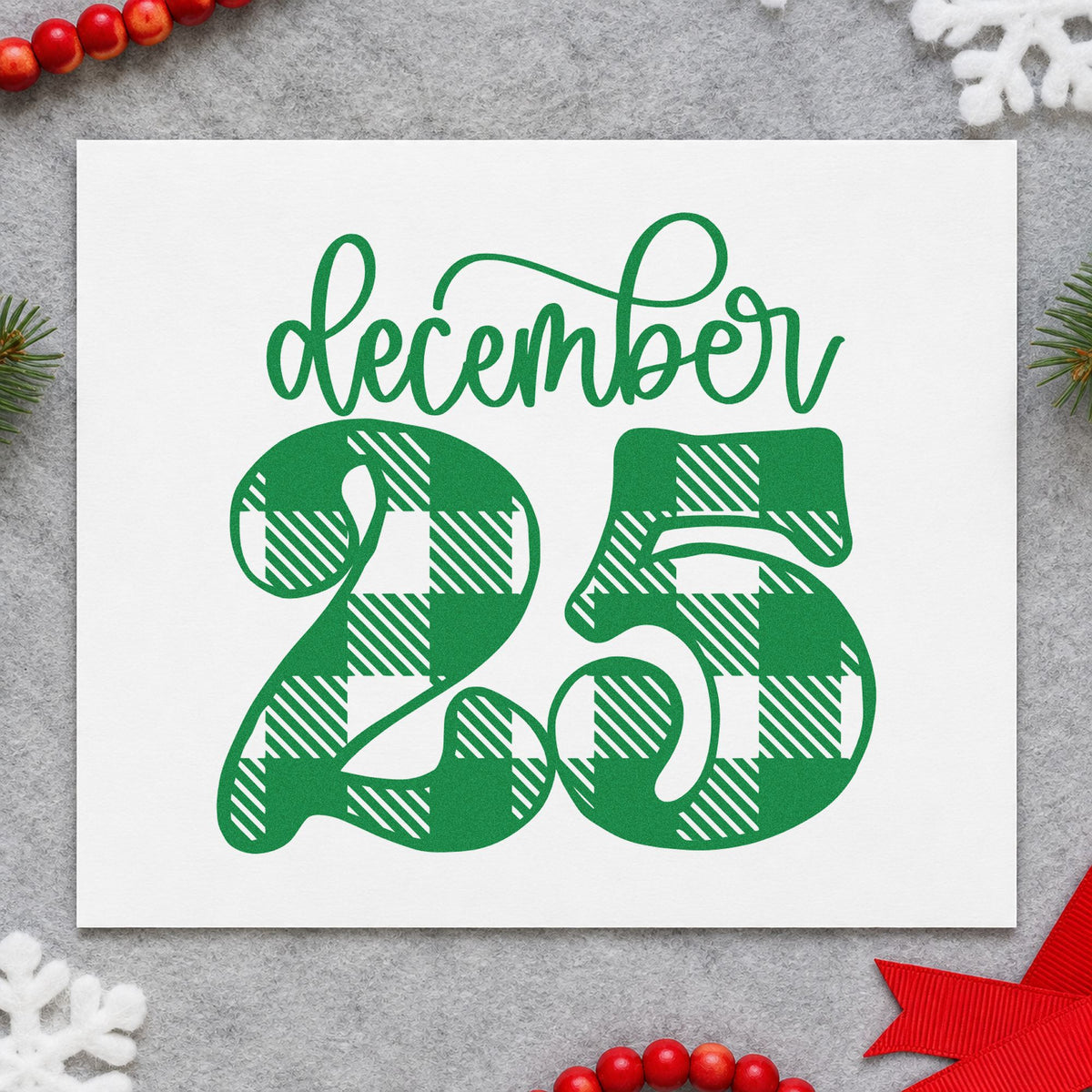 December Twenty Five Plaid craft stamp imprint in green ink on a handmade project, one idea being plaid wrap gift tags.