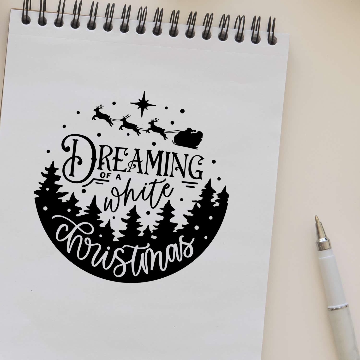 Rubber stamp design of Santa sleigh and reindeer with trees and Dreaming of a white Christmas holiday quote.
