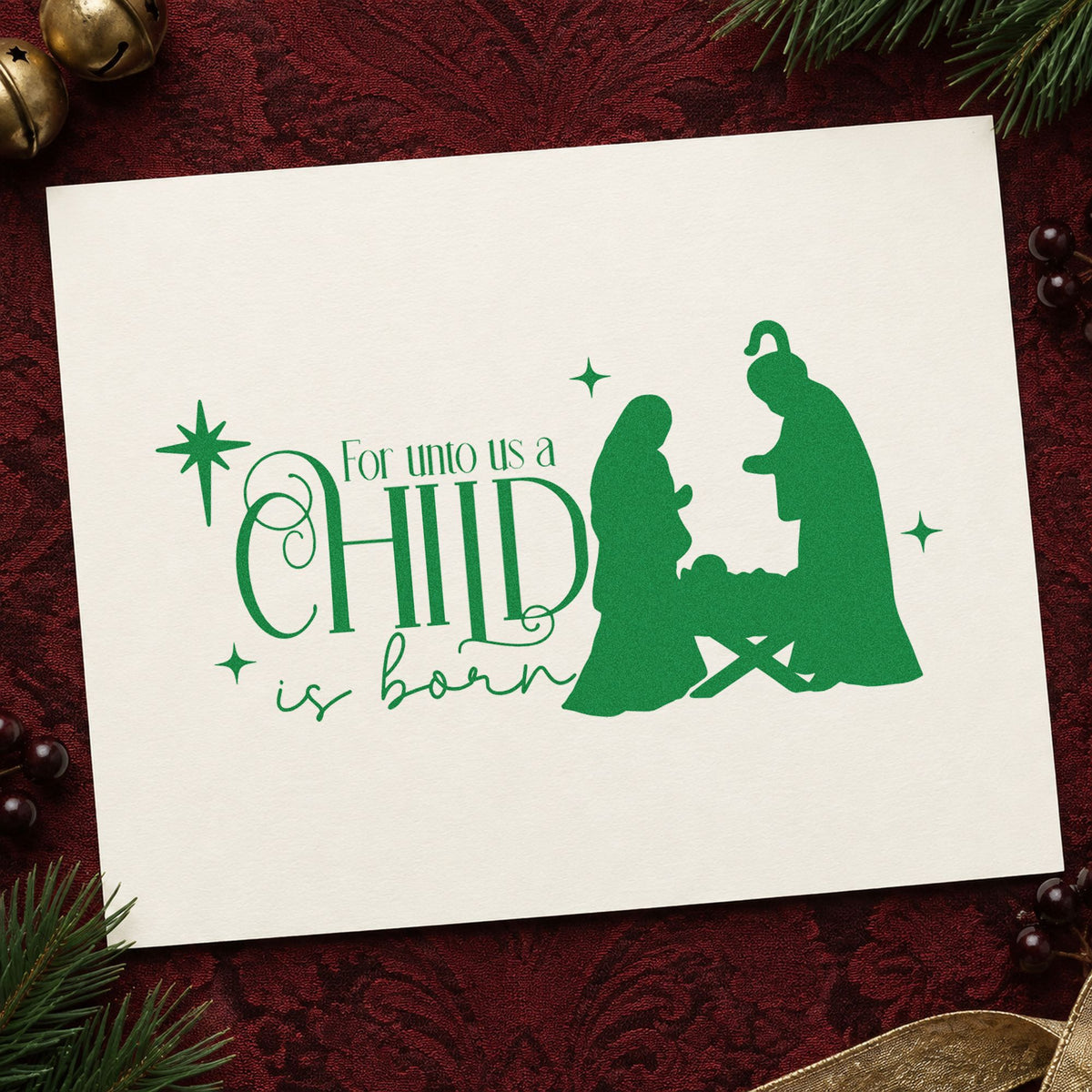Unto Us Child Is Born craft stamp imprinted in green ink on paper, a design suited to framed prayer corner.