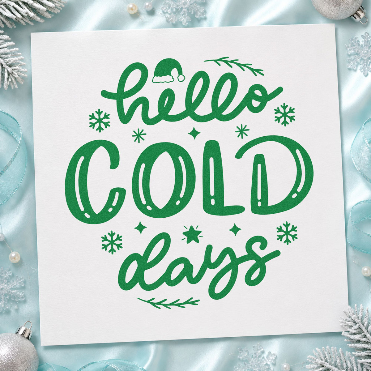Hello Cold Days craft stamp imprinted in green ink on paper, a design suited to framed shop window.