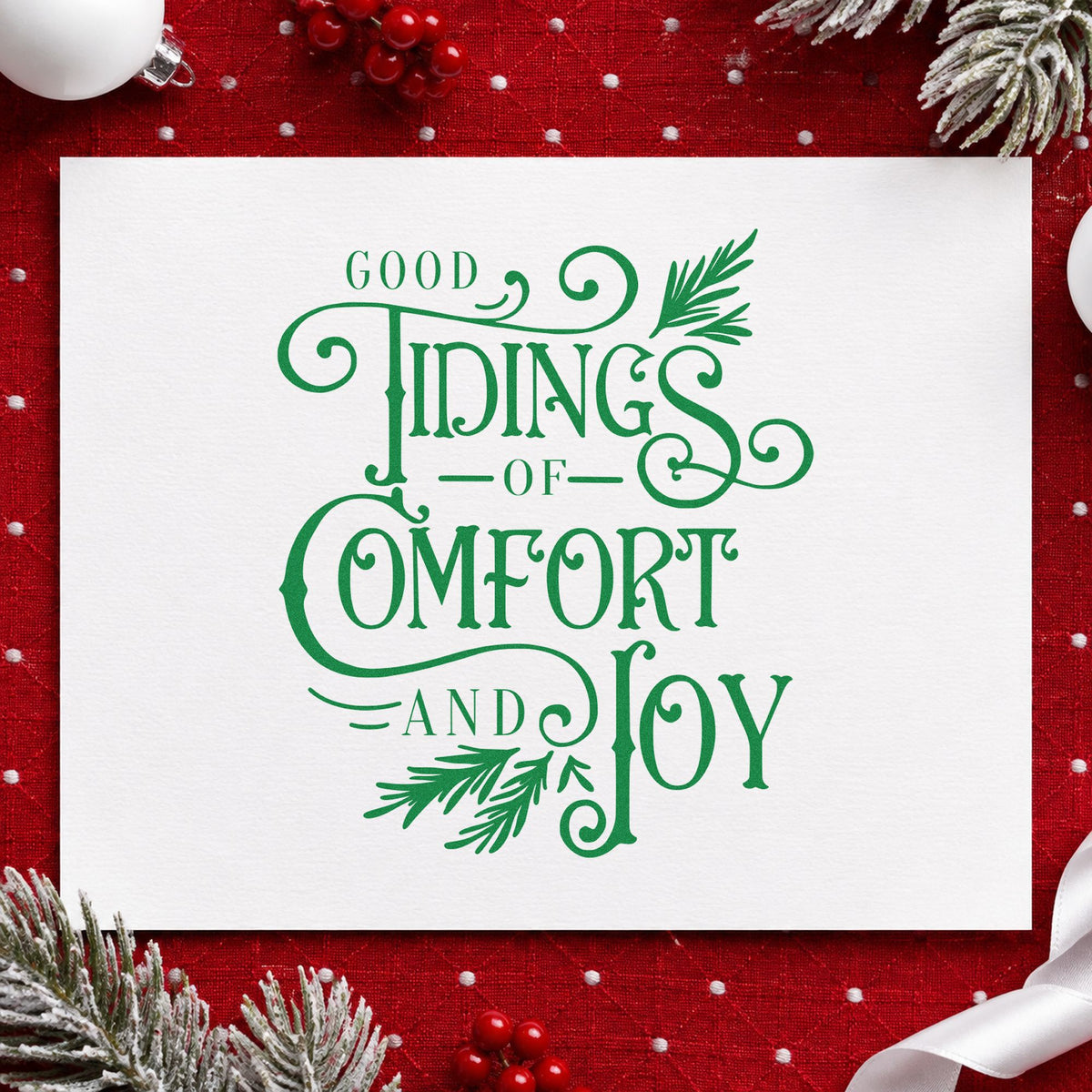 Good Tidings Comfort Joy craft stamp imprinted in green ink on paper, a design suited to framed reception desk.
