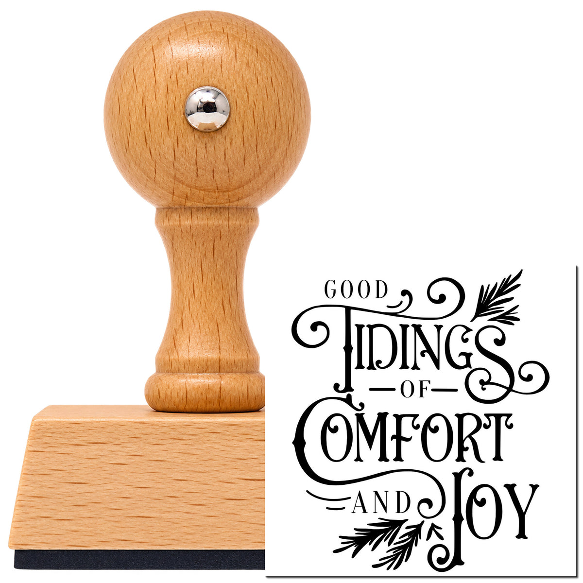 Good Tidings Comfort Joy Vintage Pro rubber stamp in European beech wood with a round knob handle, shown beside its black imprint.