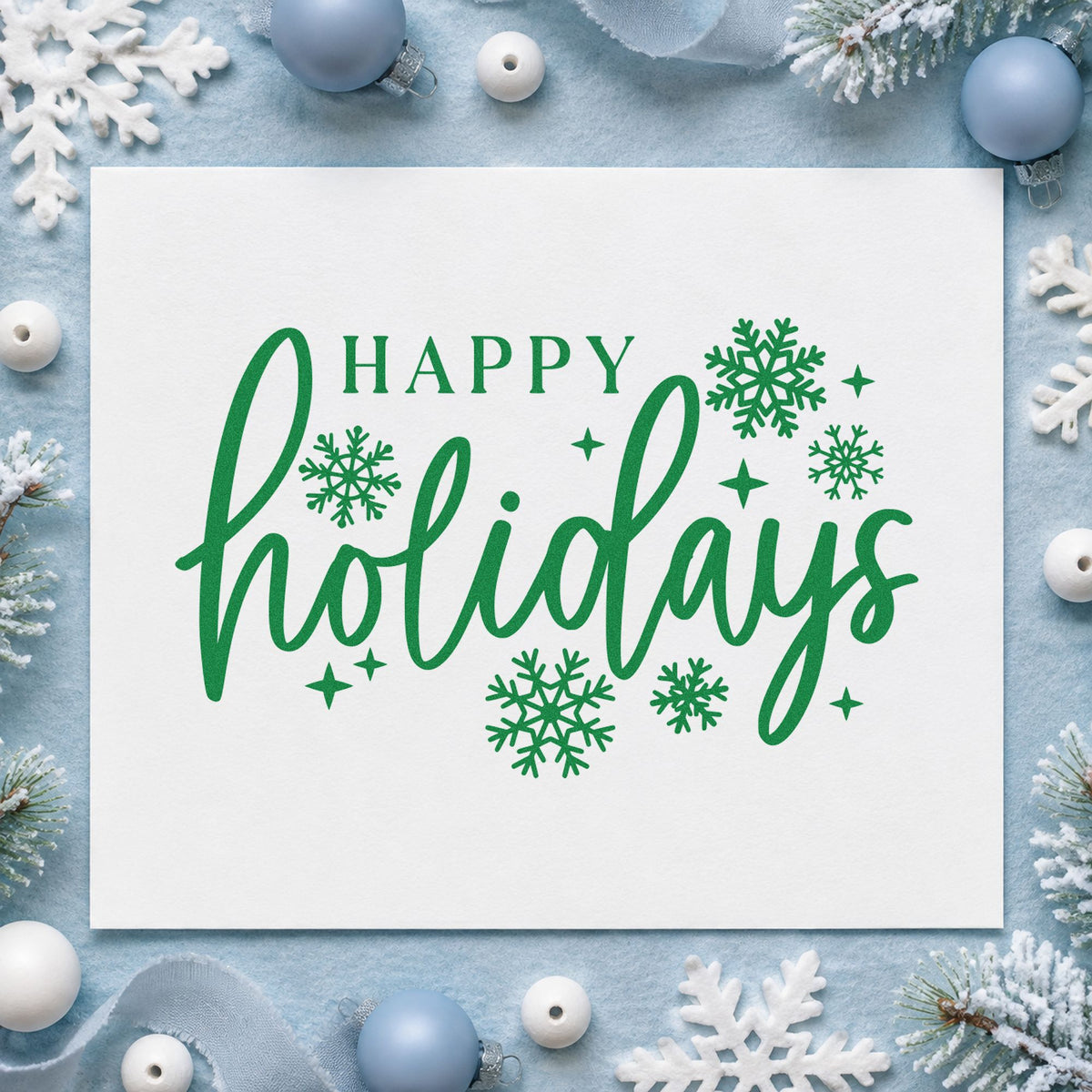 Happy Holidays Snowflakes craft stamp imprint in green ink on a handmade project, one idea being neutral gift tags.