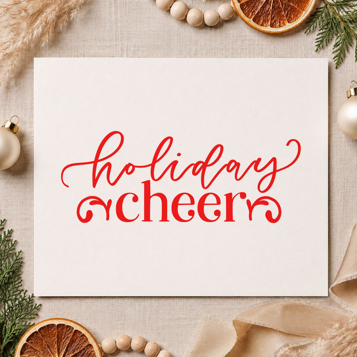 Holiday Cheer Flourishes craft stamp in red ink on cardstock, an easy option for server apron printing.