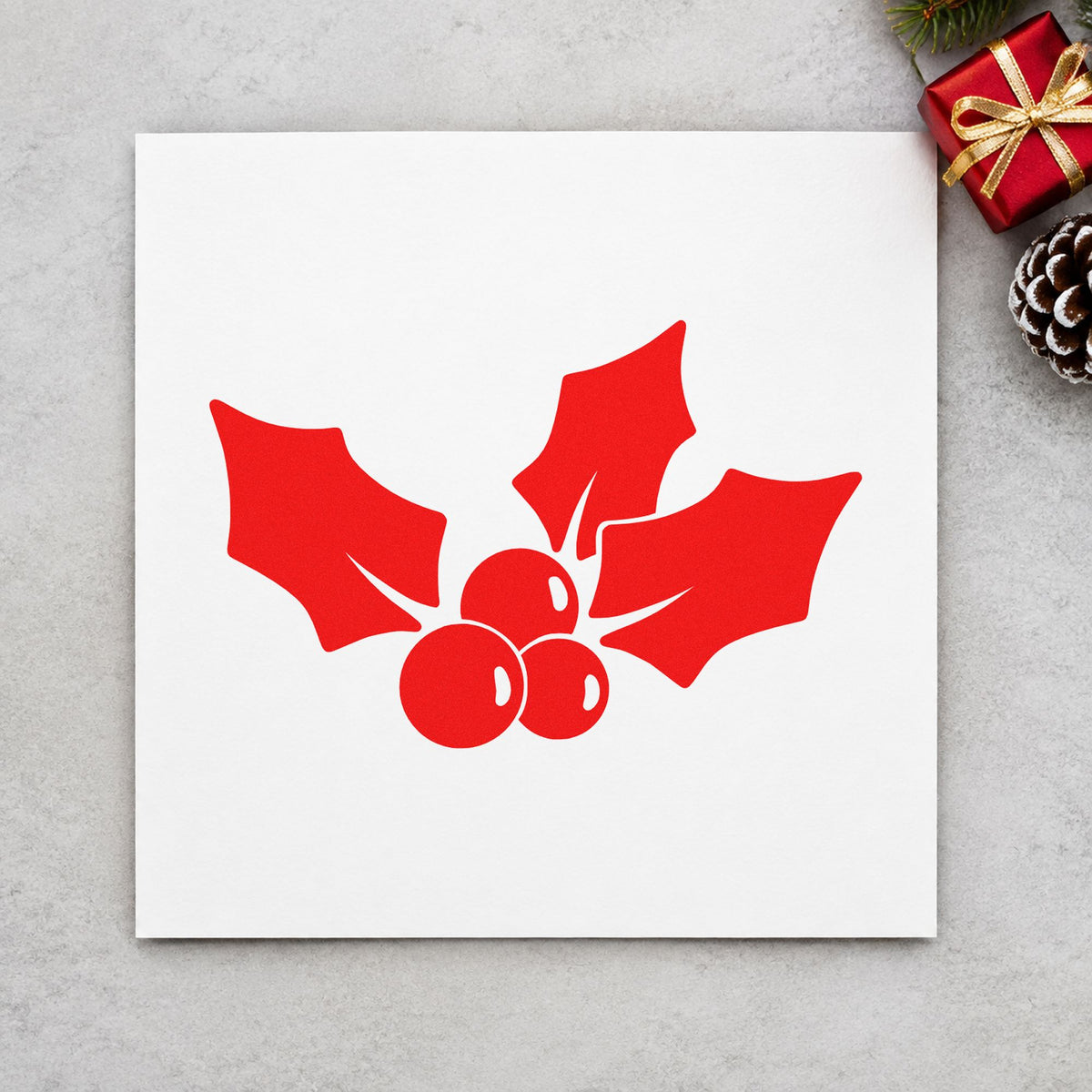 Three Leaf Holly Sprig craft stamp in red ink on cardstock, an easy option for ribbon trim printing.