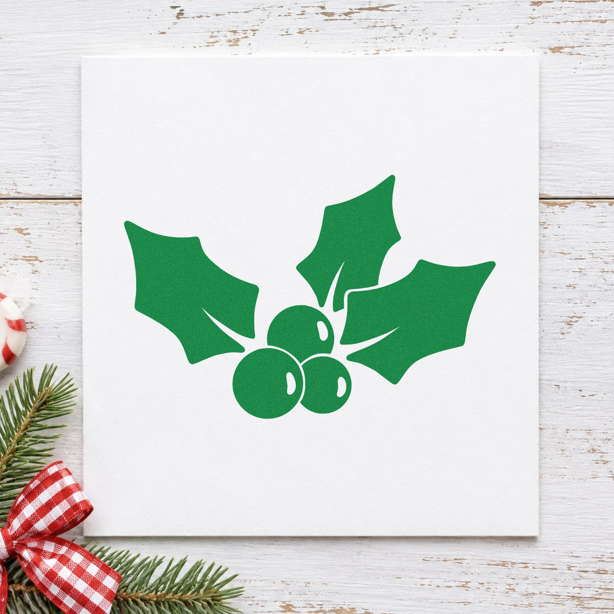 Three Leaf Holly Sprig craft stamp imprint in green ink on a handmade project, one idea being napkin band wraps.