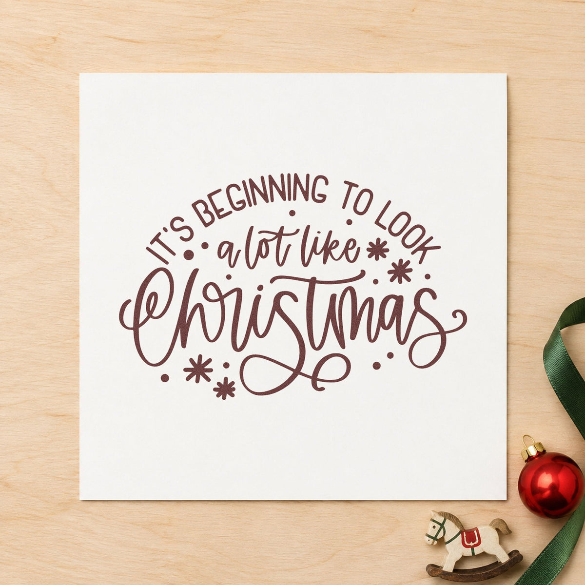 Beginning To Look Like Christmas rubber stamp printed in brown ink, ready for setup order checklist and similar paper crafts.