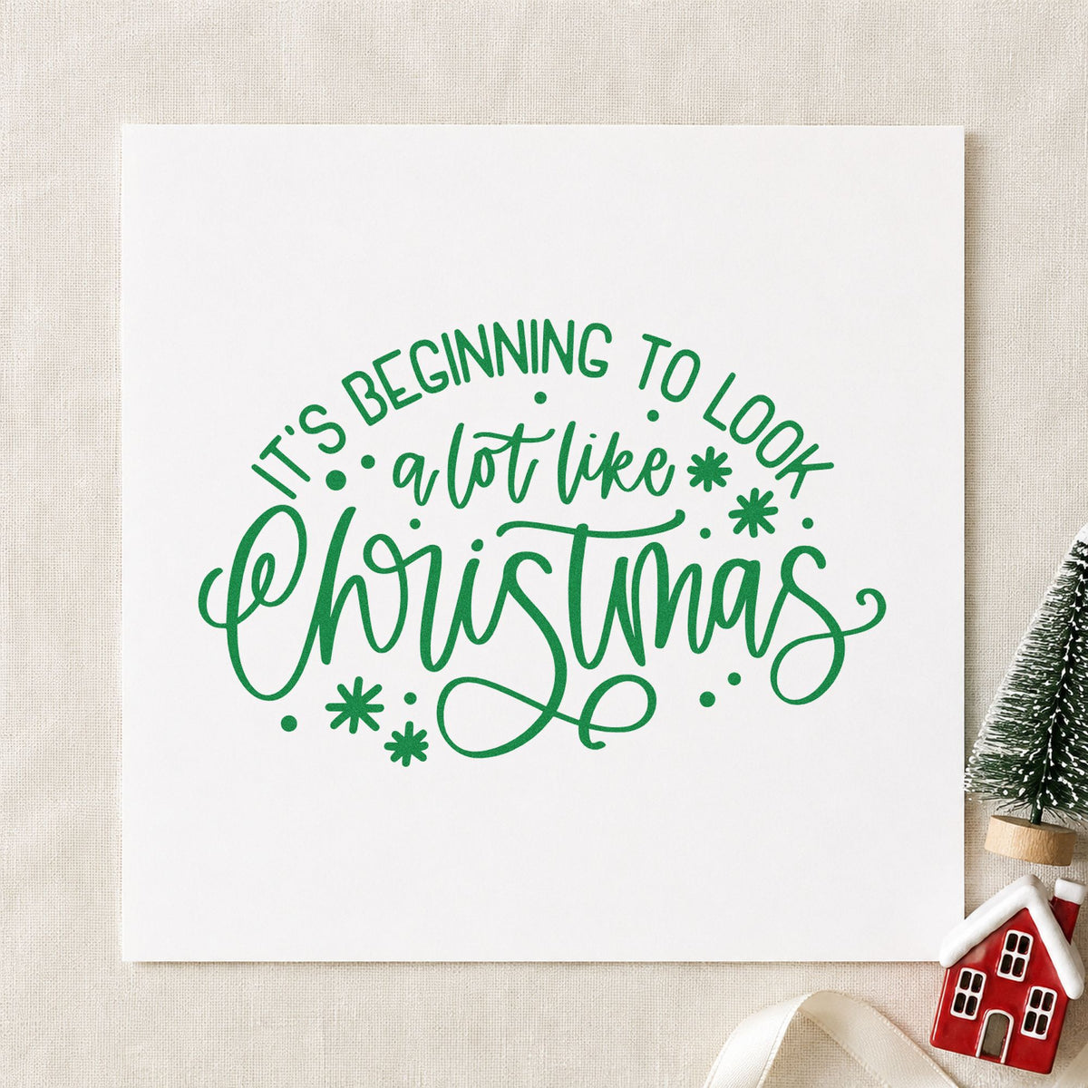 Beginning To Look Like Christmas craft stamp imprinted in green ink on paper, a design suited to framed attic door.