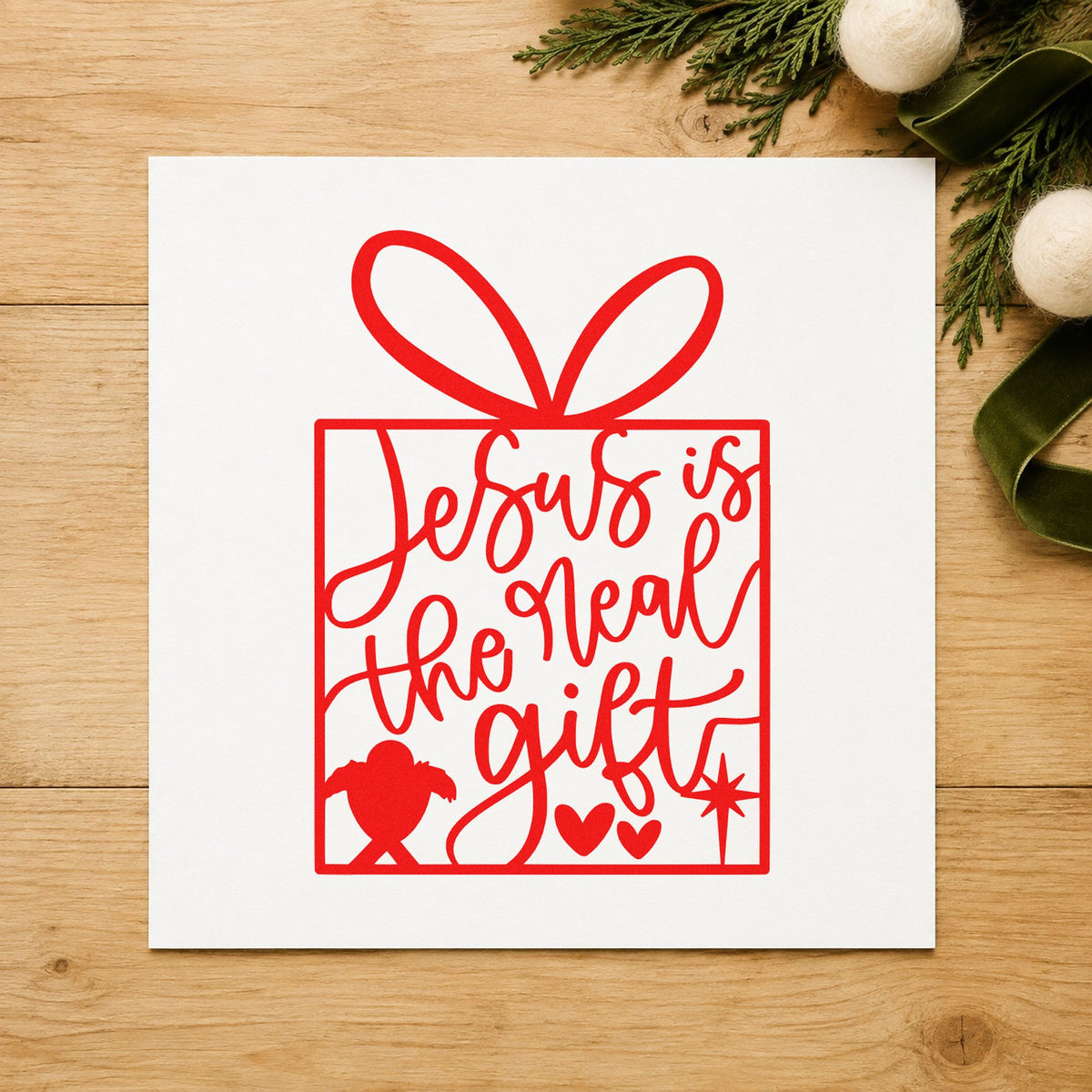 Jesus Is The Real Gift rubber stamp shown in red ink, stamped for projects such as donation bin labels.