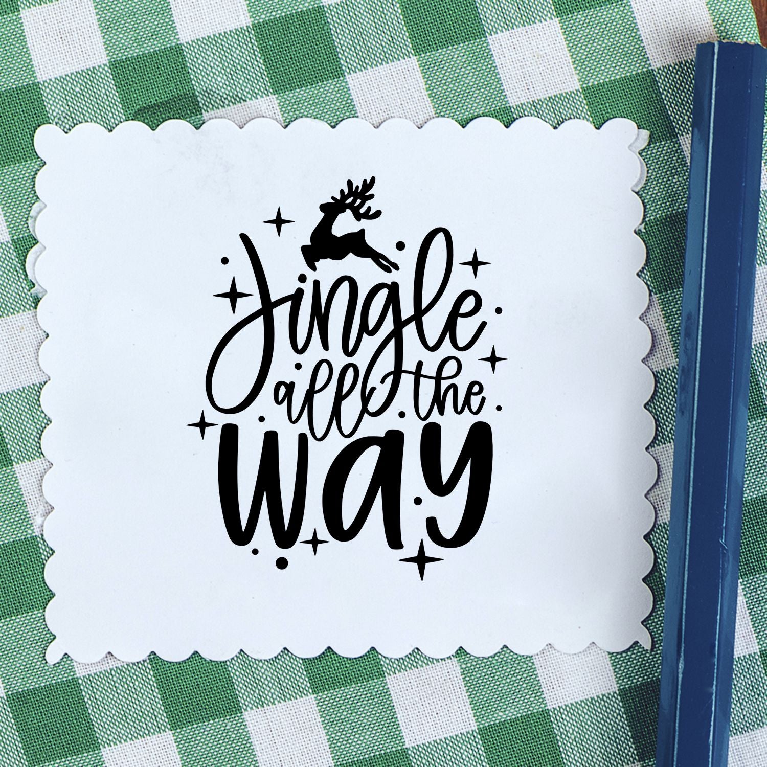 Christmas rubber stamp impression reading Jingle all the Way with reindeer, perfect for holiday card making and festive crafts.