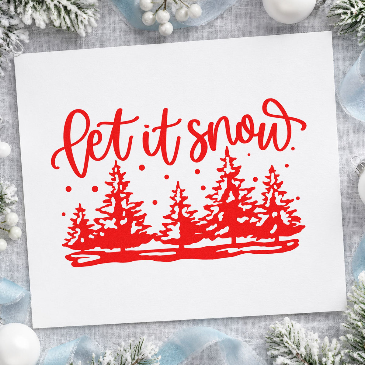 Let It Snow Pine Forest rubber stamp shown in red ink, stamped for projects such as garland bundle labels.