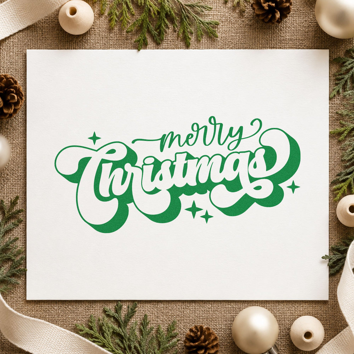 Merry Christmas Shadow Script craft stamp imprint in green ink on a handmade project, one idea being bulk gift tags.