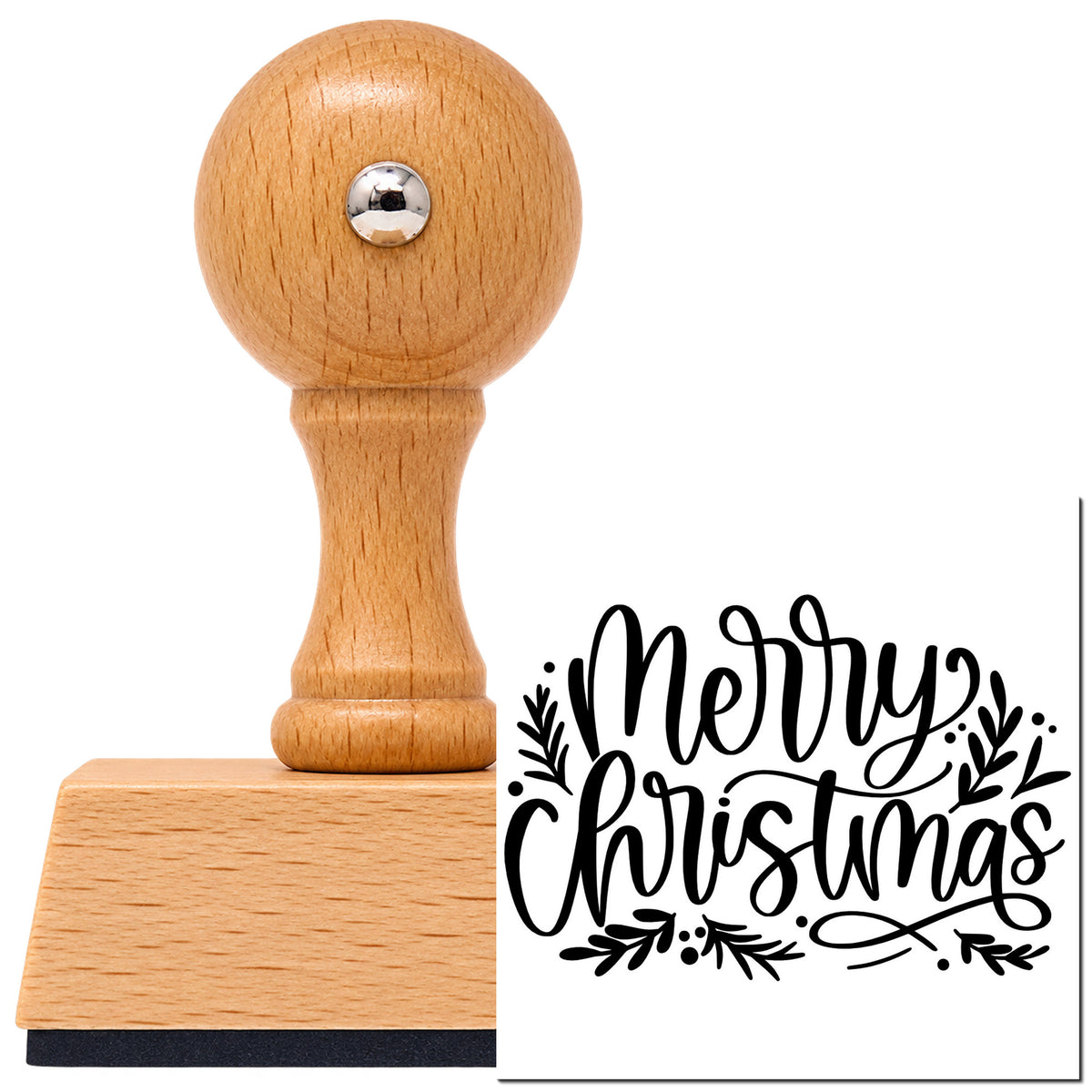 Merry Christmas Leaf Flourishes Leafy Branches Vintage Pro rubber stamp in European beech wood with a round knob handle, shown beside its black imprint.