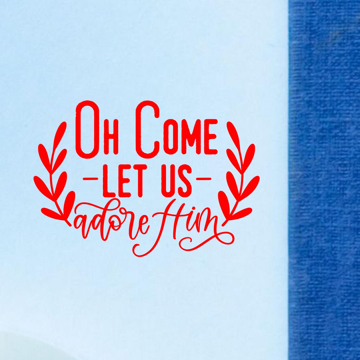 Christmas rubber stamp design reading Oh Come Let Us Adore Him with leafy accents in red ink.