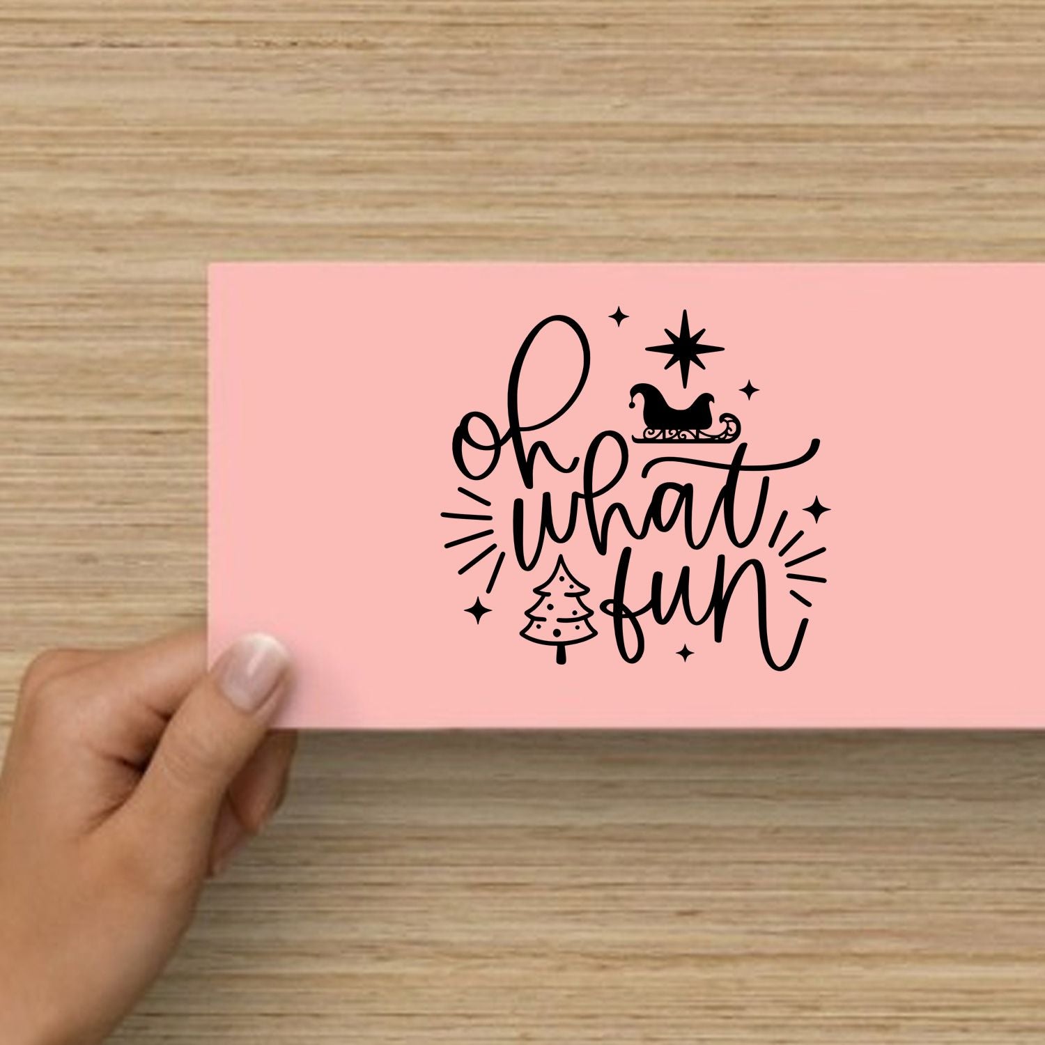 Festive Oh What Fun rubber stamp design with sleigh, tree and stars on pink card for holiday card making.