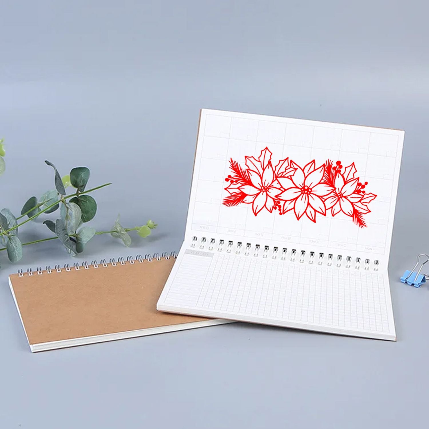 Poinsettia floral rubber stamp design on a planner page, ideal for Christmas card making and festive crafts.