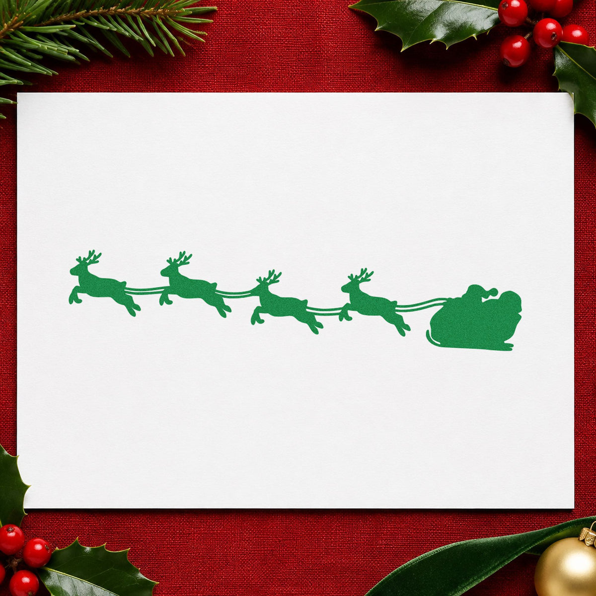 Santa Sleigh Reindeer Silhouette craft stamp imprint in green ink on a handmade project, one idea being buffet table runners.